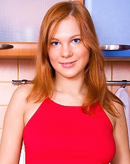 Redhead teen shows her great tits